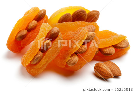 Dried apricots with almonds isolated Dried apricots with almonds isolated 55235018