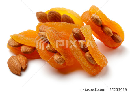 Dried apricots with almonds isolated Dried apricots with almonds isolated 55235019
