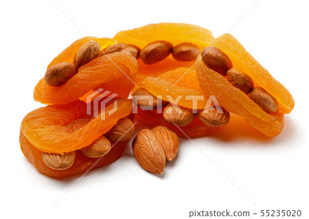 Dried apricots with almonds isolated Dried apricots with almonds isolated 55235020