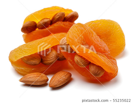 Dried apricots with almonds isolated 55235022