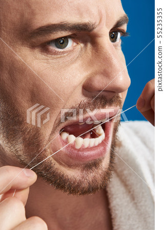 Two smiling male colleagues talking about their working tasks 55235355