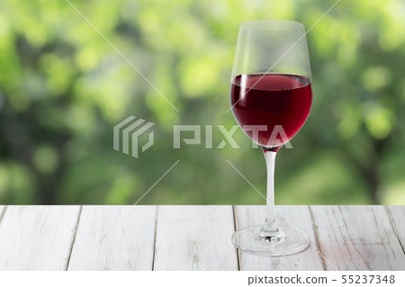 Red wine and forest background 55237348