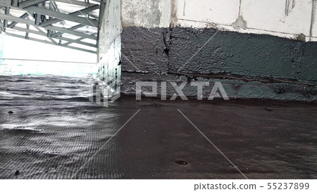 Waterproofing membrane applied by workers Waterproofing membrane applied by workers 55237899