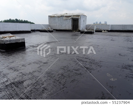 Waterproofing membrane applied by workers Waterproofing membrane applied by workers 55237904