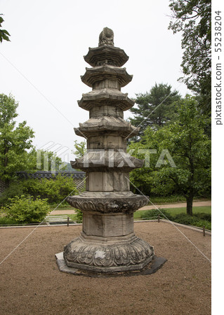 A stone pagoda built in a garden A stone pagoda built in a garden 55238204