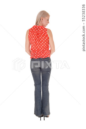 A slim middle age woman standing from the back 55238336