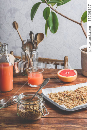 Homebaked granola with juice Homebaked granola with juice 55239397