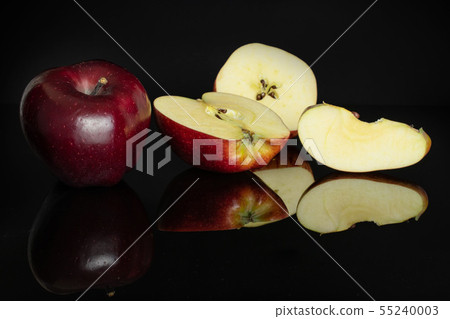 Apple red delicious isolated on black glass Apple red delicious isolated on black glass 55240003