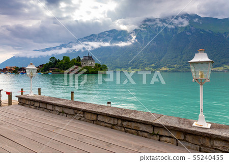 The Swiss village of Iseltwald on the famous lake Brienz. The Swiss village of Iseltwald on the famous lake Brienz. 55240455