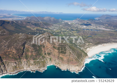 Aerial view of Cape point with lighthouse and Cape of Good Hope from a helicopter. Panorama of South 55242629
