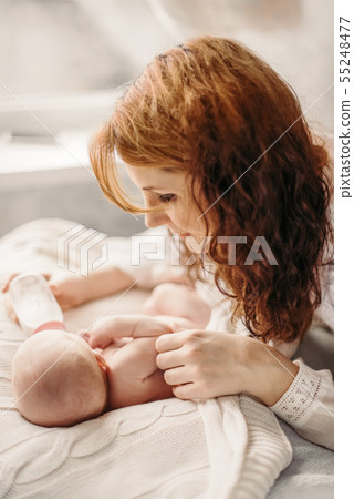 Artificial breastfeeding, bottle feeding the baby. Maternity lifestyle concept. 55248477