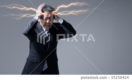 A man with a headache 55250424