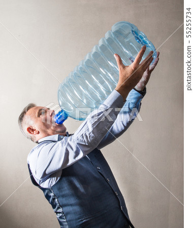 man  with a giant water bottle 55255734
