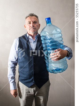 man  with a giant water bottle 55255735