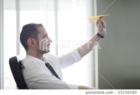 Businessman Throwing Paper Airplane 55256580