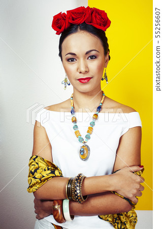 young pretty mexican woman smiling happy on yellow background, lifestyle people concept young pretty mexican woman smiling happy on yellow background, lifestyle people concept 55256607