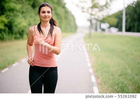 Active woman jogging in the park. Sport, fitness 55261092