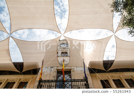 Mallorca cityscape cream wall stone building and sun protection cream sheet and dazzling sun Mallorca cityscape cream wall stone building and sun protection cream sheet and dazzling sun 55261943