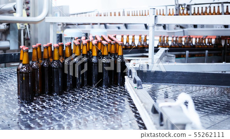 Beer bottles on the conveyor belt. Shallow dof. Selective focus. Beer bottles on the conveyor belt. Shallow dof. Selective focus. 55262111