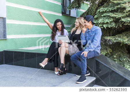 student looks exam results on the tablet 55262393