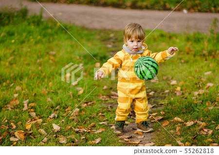 Happybaby boy laughing and playing with green ball Happybaby boy laughing and playing with green ball 55262818