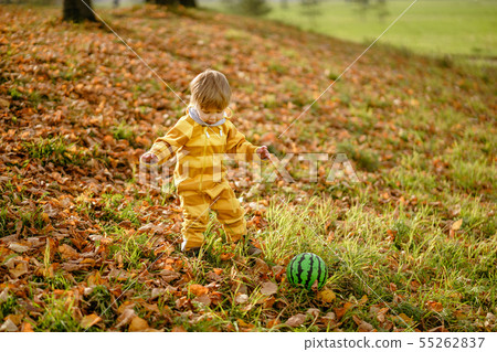 Happybaby boy laughing and playing with green ball 55262837