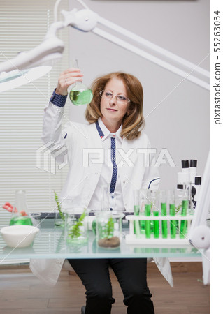 Portrait of middle age woman working in microbiology industry 55263034