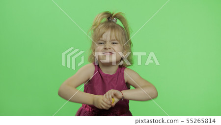 Disappointed blonde girl in purple dress. Pretty little blonde child. Chroma Key Disappointed blonde girl in purple dress. Pretty little blonde child. Chroma Key 55265814