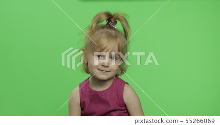 Positive girl looking to a camera in purple dress. Happy child. Chroma Key Positive girl looking to a camera in purple dress. Happy child. Chroma Key 55266069