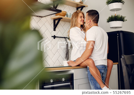 Beautiful couple spend time in a kitchen 55267695