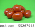 Red tomatoes on green background. Vegetables 55267948