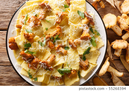 Italian ravioli with chanterelles and parmesan Italian ravioli with chanterelles and parmesan 55268394