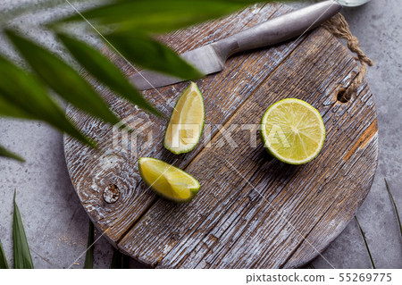 Composition with mint and lemon on grey background Composition with mint and lemon on grey background 55269775