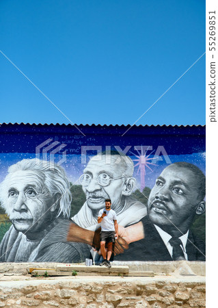 Man Painting Graffiti Along The Camino de Santiago Man Painting Graffiti Along The Camino de Santiago 55269851