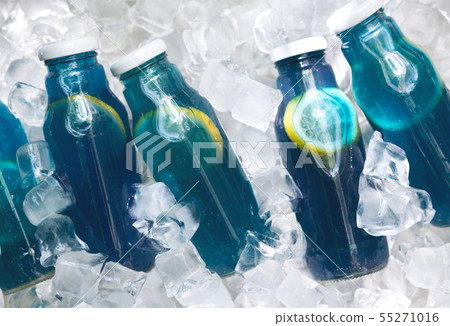 Variety of lemon infused detox lemonade in glass bottle 55271016