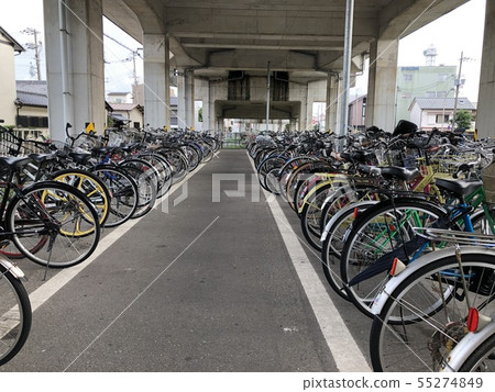 Bicycles under bicycle overpass 55274849