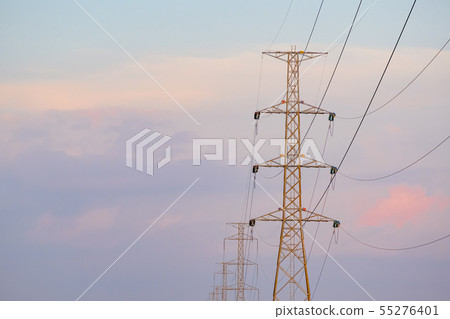 High voltage tower and line cables, in sunset sky High voltage tower and line cables, in sunset sky 55276401