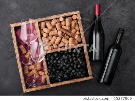 Bottles of red wine on wood with empty glasses and Bottles of red wine on wood with empty glasses and 55277969