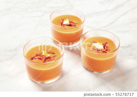 Salmorejo, Spanish cold tomato soup, in glasses on a marble background Salmorejo, Spanish cold tomato soup, in glasses on a marble background 55278717
