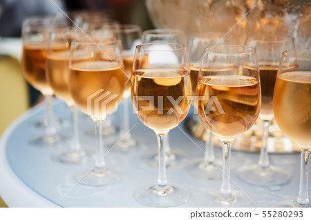 The beautiful wine glasses with rose wine The beautiful wine glasses with rose wine 55280293
