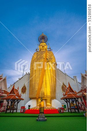 A golden tall Buddha standing at wat Intharawihan. A golden tall Buddha standing at wat Intharawihan. 55280858