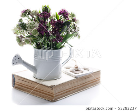Bouquet of wildflowers in a white watering can Bouquet of wildflowers in a white watering can 55282237