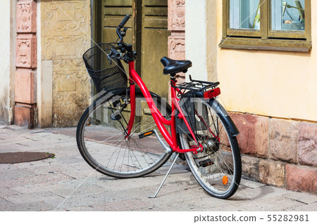 red bike on city street red bike on city street 55282981