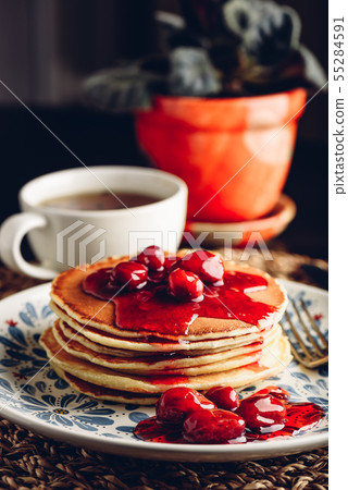 Stack of pancakes with cornelian cherry jam on 55284591