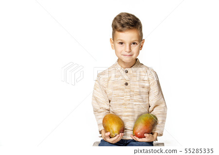 handsome pretty boy is holding a mango  55285335
