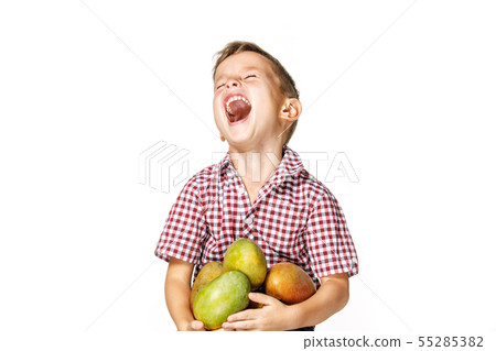 handsome boy in a red shirt with a mango 55285382