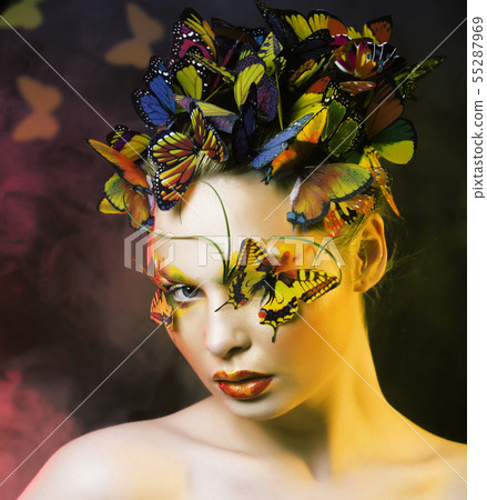 woman with summer creative make up like fairy butterfly closeup bright colored background 55287969