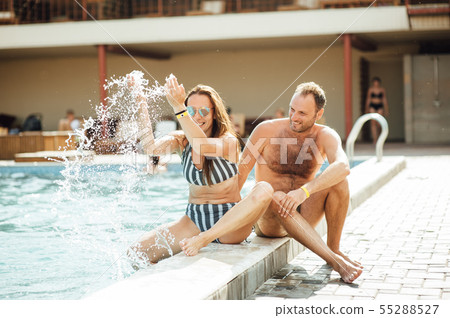 beautiful couple having fun by the pool 55288527
