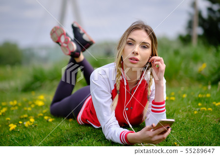 portrait outdoors of a young beautiful woman at portrait outdoors of a young beautiful woman at 55289647