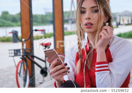 portrait outdoors of a young beautiful woman at portrait outdoors of a young beautiful woman at 55289652